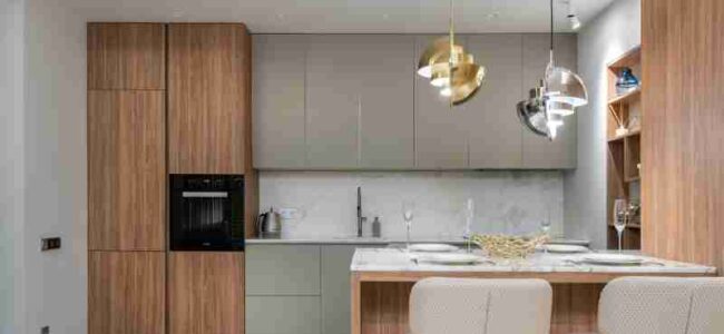 Sleek and contemporary kitchen with wood cabinetry and modern lighting., tags: küchen - pexel